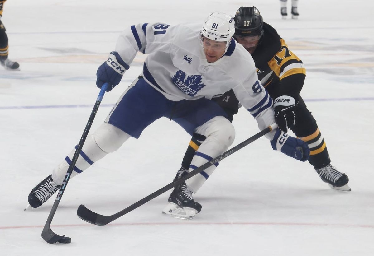 Nov 29, 2025; Pittsburgh, Pennsylvania, USA;  Toronto Maple Leafs center Dakota Joshua (81) skates with the puck against Pittsburgh Penguins right wing Bryan Rust (17) during the second period at PPG Paints Arena. Mandatory Credit: Charles LeClaire-Imagn Images