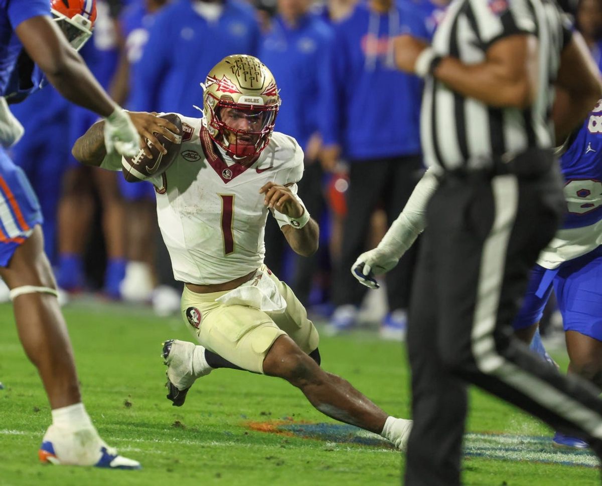 Florida State quarterback Tommy Castellanos (1) gets chased down during the second half of an NCAA football game at Steve Spurrier Field at Ben Hill Griffin Stadium in Gainesville, FL on Saturday, November 29, Florida beat Florida State 40-21.2025. [Alan Youngblood/Gainesville Sun]