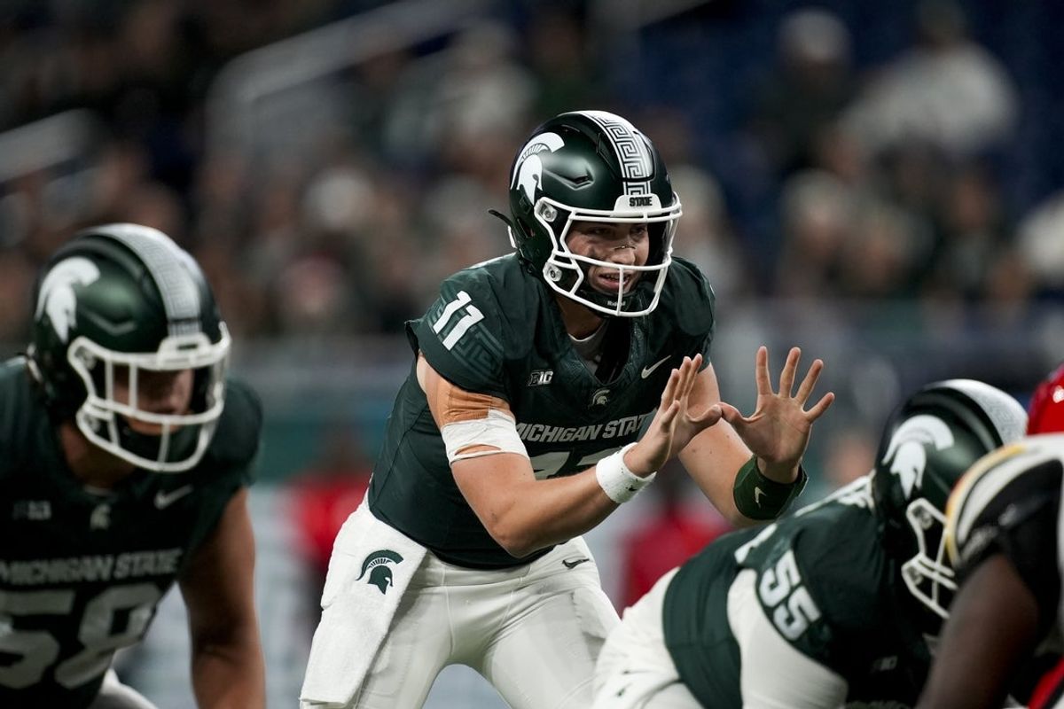 Nov 29, 2025; Detroit, Michigan, USA; Michigan State quarterback Alessio Milivojevic (11) prepares to take a snap in the first quarter against Maryland at Ford Field. Mandatory Credit: Brendan Mullin-Imagn Images