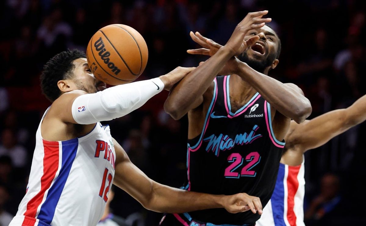 Nov 29, 2025; Miami, Florida, USA; Detroit Pistons forward Tobias Harris (12) fouls Miami Heat forward Andrew Wiggins (22) during the first half at Kaseya Center. Mandatory Credit: Rhona Wise-Imagn Images