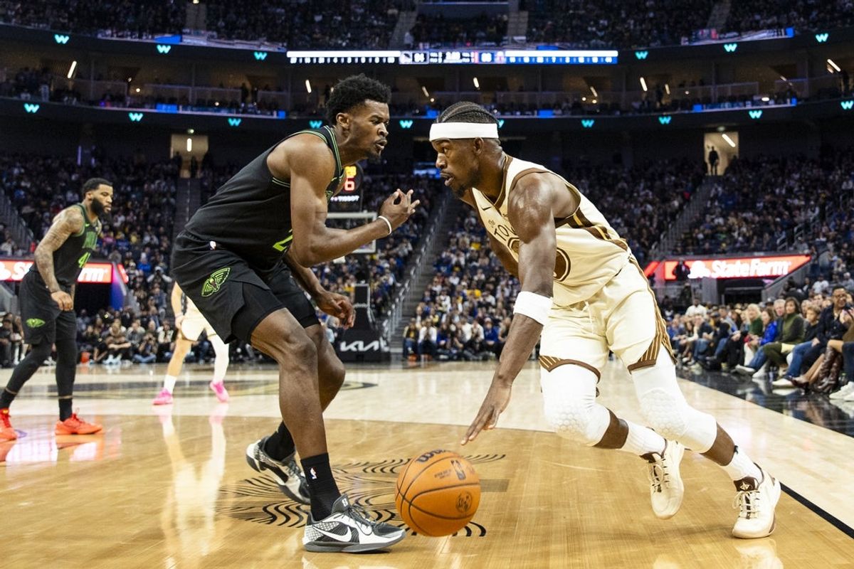 Nov 29, 2025; San Francisco, California, USA; Golden State Warriors forward Jimmy Butler III (10) drives past New Orleans Pelicans center Yves Missi (21) during the fourth quarter at Chase Center. Mandatory Credit: John Hefti-Imagn Images