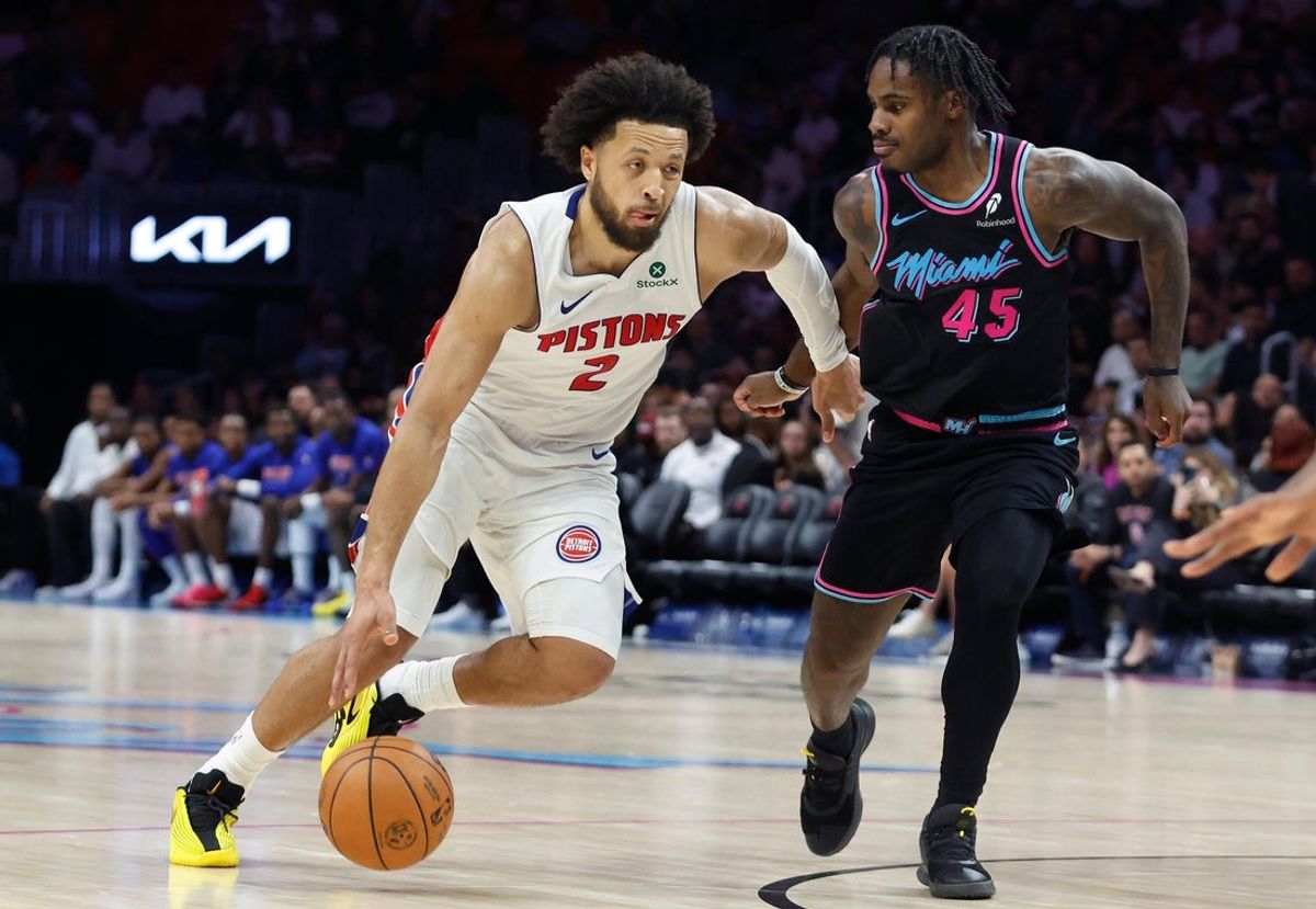 Nov 29, 2025; Miami, Florida, USA; Detroit Pistons guard Cade Cunningham (2) drives to the basket against Miami Heat guard Davion Mitchell (45) during the second half at Kaseya Center. Mandatory Credit: Rhona Wise-Imagn Images