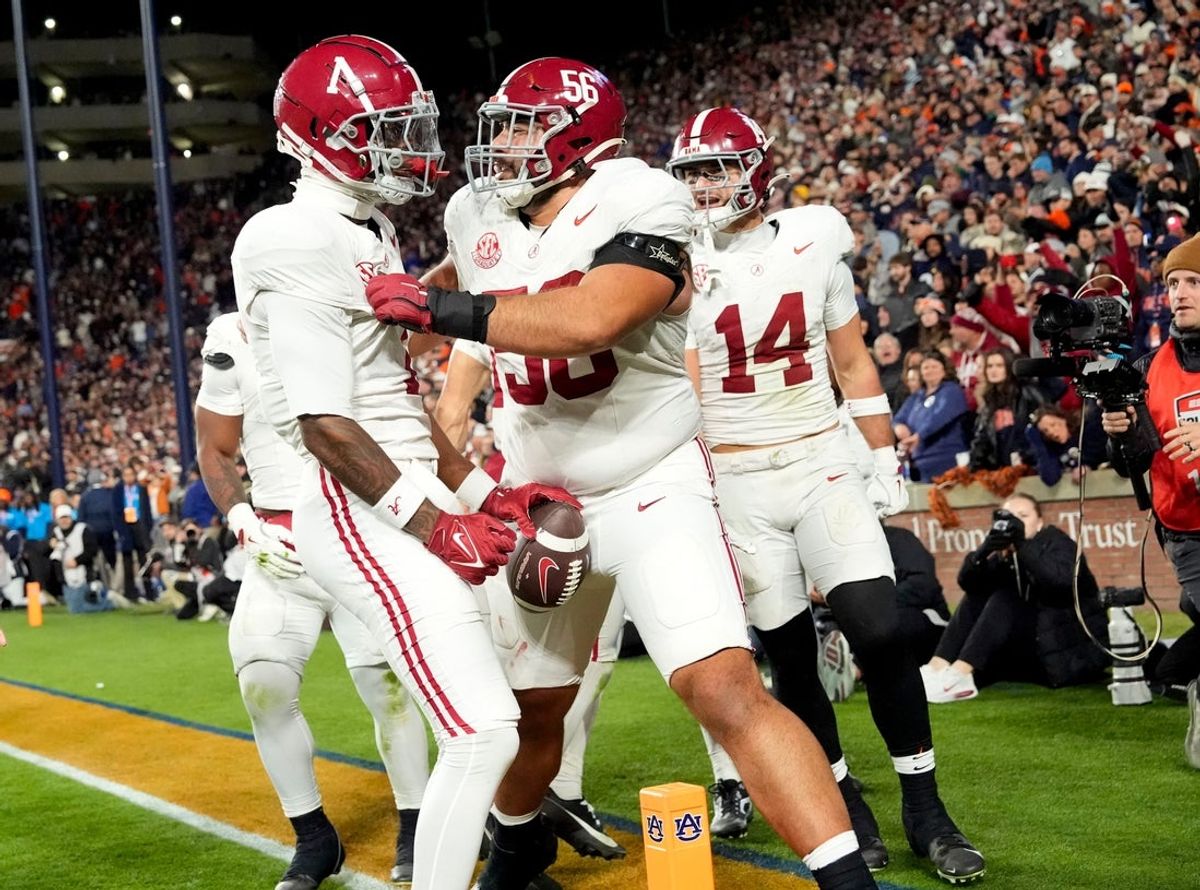 Nov 29, 2025; Auburn, Alabama, USA; Alabama wide receiver Isaiah Horton (1) celebrates with Alabama offensive lineman Geno VanDeMark (56) after catching his third touchdown pass of the game, giving Alabama a 27-20 lead at Jordan-Hare Stadium. Mandatory Credit: Gary Cosby Jr.-Tuscaloosa News