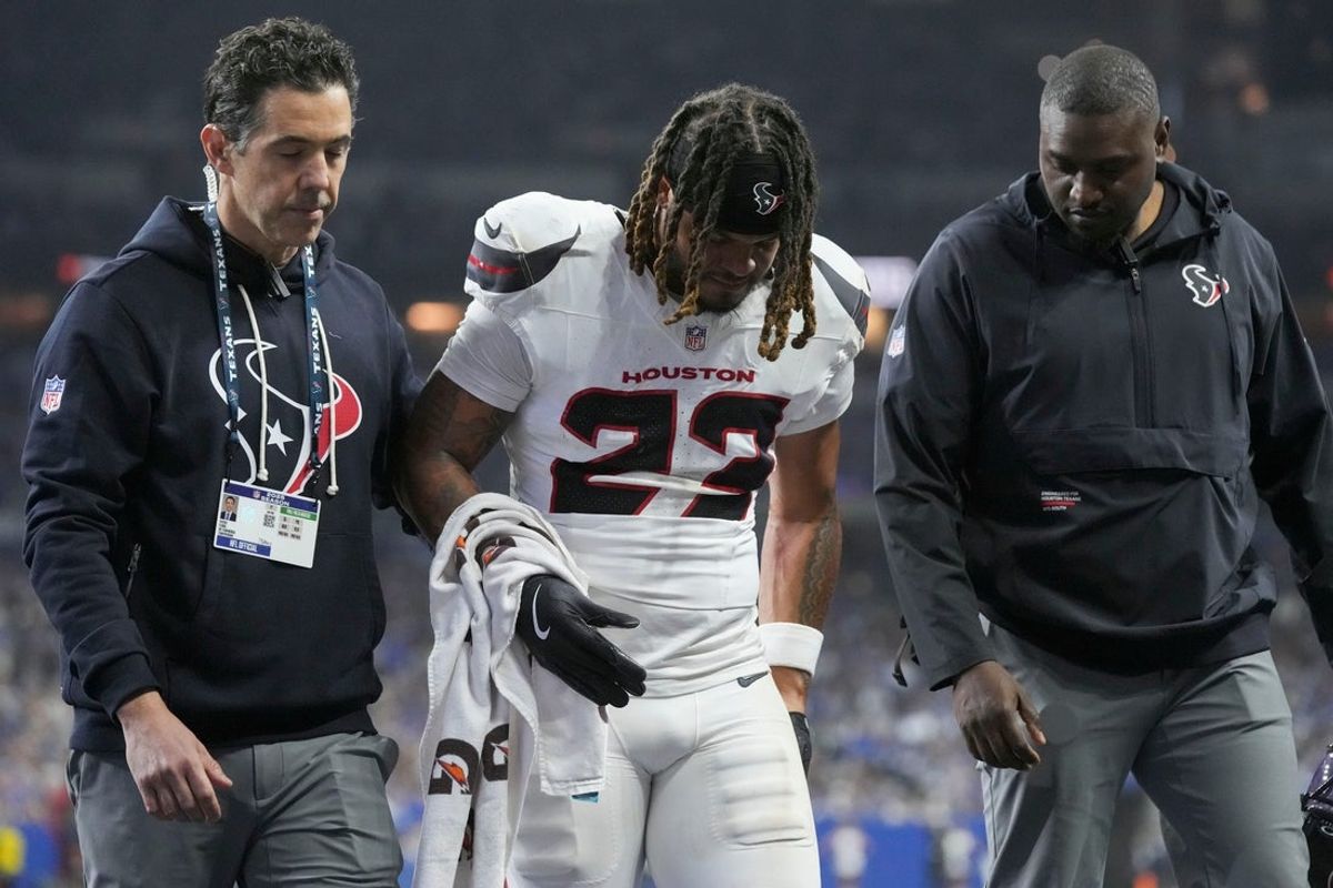 Houston Texans safety Jaylen Reed (23) is helped off the field following an injury Sunday, Nov. 30, 2025, during a game against the Indianapolis Colts at Lucas Oil Stadium in Indianapolis.