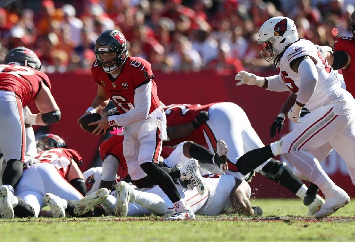 Nov 30, 2025; Tampa, Florida, USA; Tampa Bay Buccaneers quarterback Baker Mayfield (6) scrambles during the first half against the Arizona Cardinals at Raymond James Stadium. Mandatory Credit: Nathan Ray Seebeck-Imagn Images