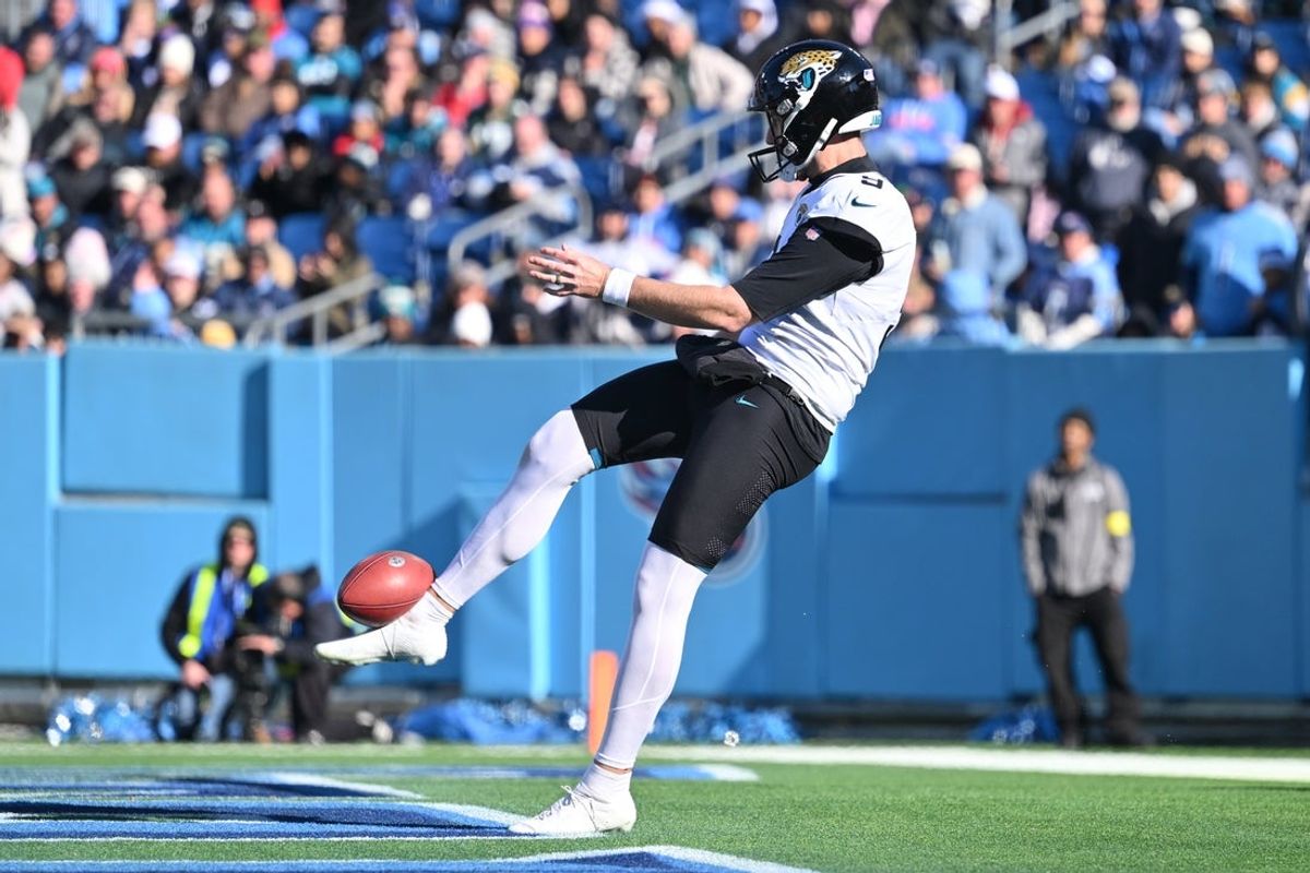 Nov 30, 2025; Nashville, Tennessee, USA; Jacksonville Jaguars punter Logan Cooke (9) punts the ball against the Tennessee Titans during the first half at Nissan Stadium. Mandatory Credit: Steve Roberts-Imagn Images