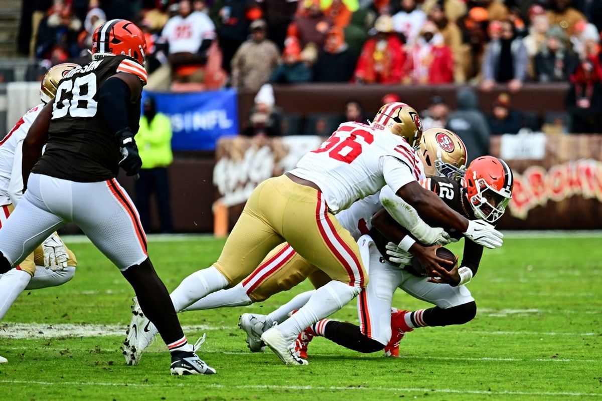 Nov 30, 2025; Cleveland, Ohio, USA;  San Francisco 49ers defensive end Keion White (56) and San Francisco 49ers defensive end Clelin Ferrell (96) sack Cleveland Browns quarterback Shedeur Sanders (12) during the second half at Huntington Bank Field. Mandatory Credit: Ken Blaze-Imagn Images