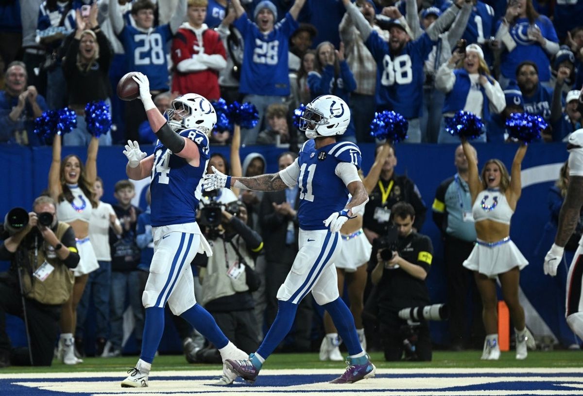 Nov 30, 2025; Indianapolis, Indiana, USA; Indianapolis Colts tight end Tyler Warren (84) celebrates with wide receiver Michael Pittman Jr. (11) after a touchdown during the second half against the Houston Texans at Lucas Oil Stadium. Mandatory Credit: Robert Goddin-Imagn Images