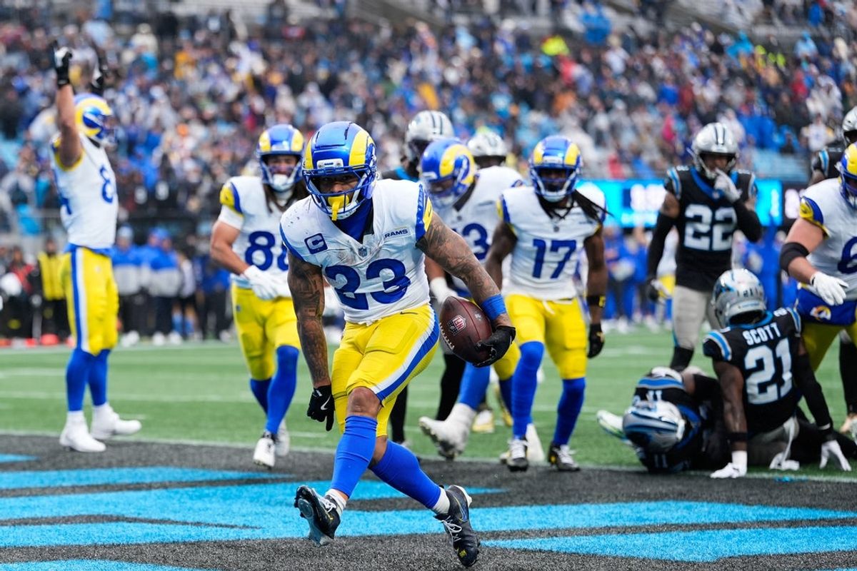 Nov 30, 2025; Charlotte, North Carolina, USA;  Los Angeles Rams running back Kyren Williams (23) scores a touchdown during the fourth quarter against the Carolina Panthers at Bank of America Stadium. Mandatory Credit: Jim Dedmon-Imagn Images