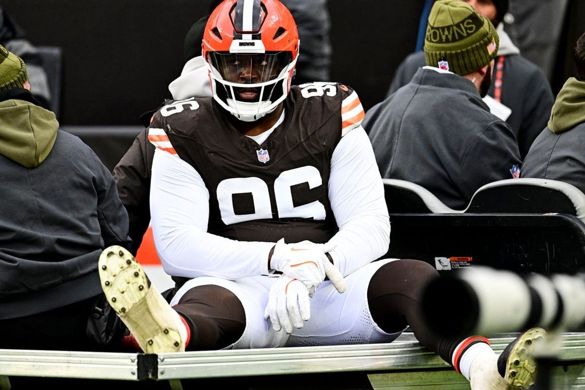 Nov 30, 2025; Cleveland, Ohio, USA;  Cleveland Browns defensive tackle Maliek Collins (96) is led off the field after an injury during the second half against the San Francisco 49ers at Huntington Bank Field. Mandatory Credit: Ken Blaze-Imagn Images