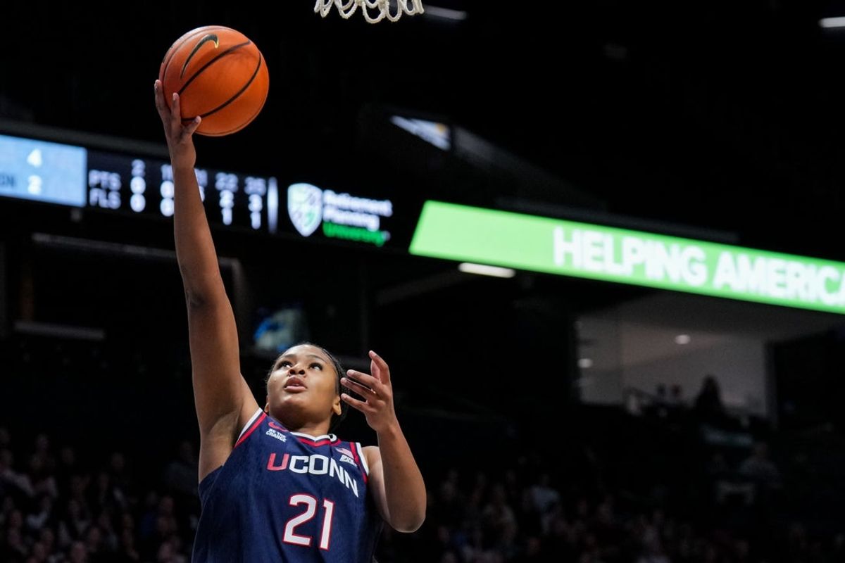 Nov 30, 2025; Cincinnati, Ohio, USA;  UConn Huskies forward Sarah Strong (21) drives to the basket against Xavier Musketeers in the first half at the Cintas Center. Mandatory Credit: Aaron Doster-Imagn Images