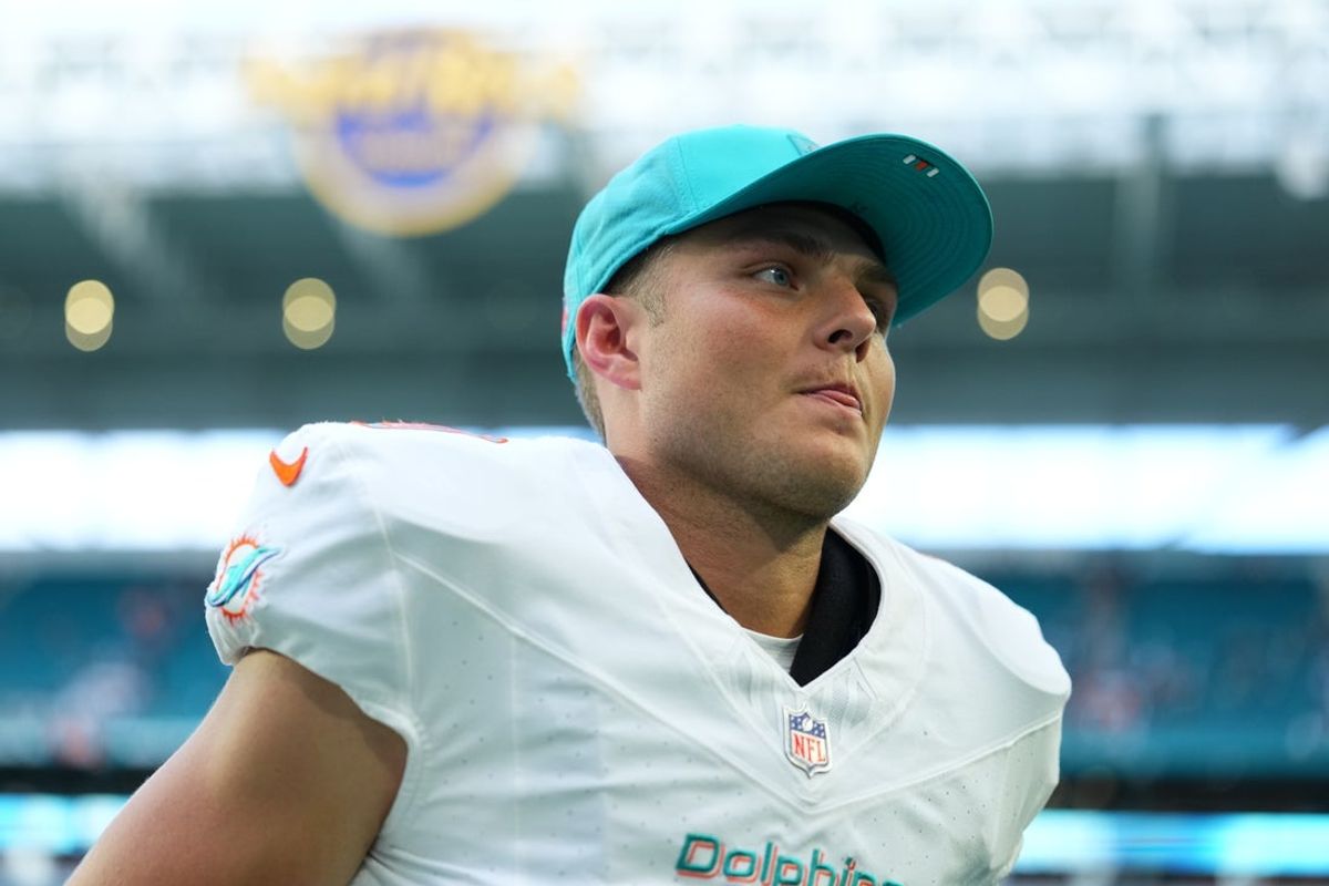 Nov 30, 2025; Miami Gardens, Florida, USA; Miami Dolphins quarterback Zach Wilson (0) leaves the field following a game against the New Orleans Saints at Hard Rock Stadium. Mandatory Credit: Rich Storry-Imagn Images
