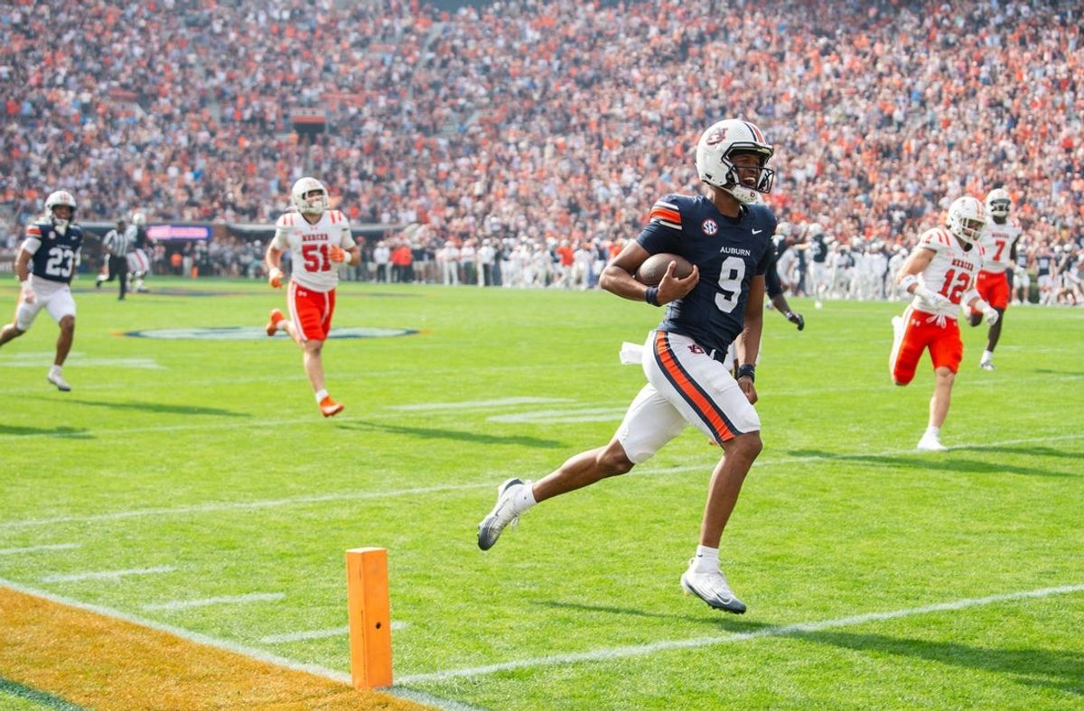 Auburn Tigers quarterback Deuce Knight (9) run in for a touchdown on the first play of the game as Auburn Tigers take on Mercer Bears at Jordan-Hare Stadium in Auburn, Ala. on Saturday, Nov. 22, 2025.