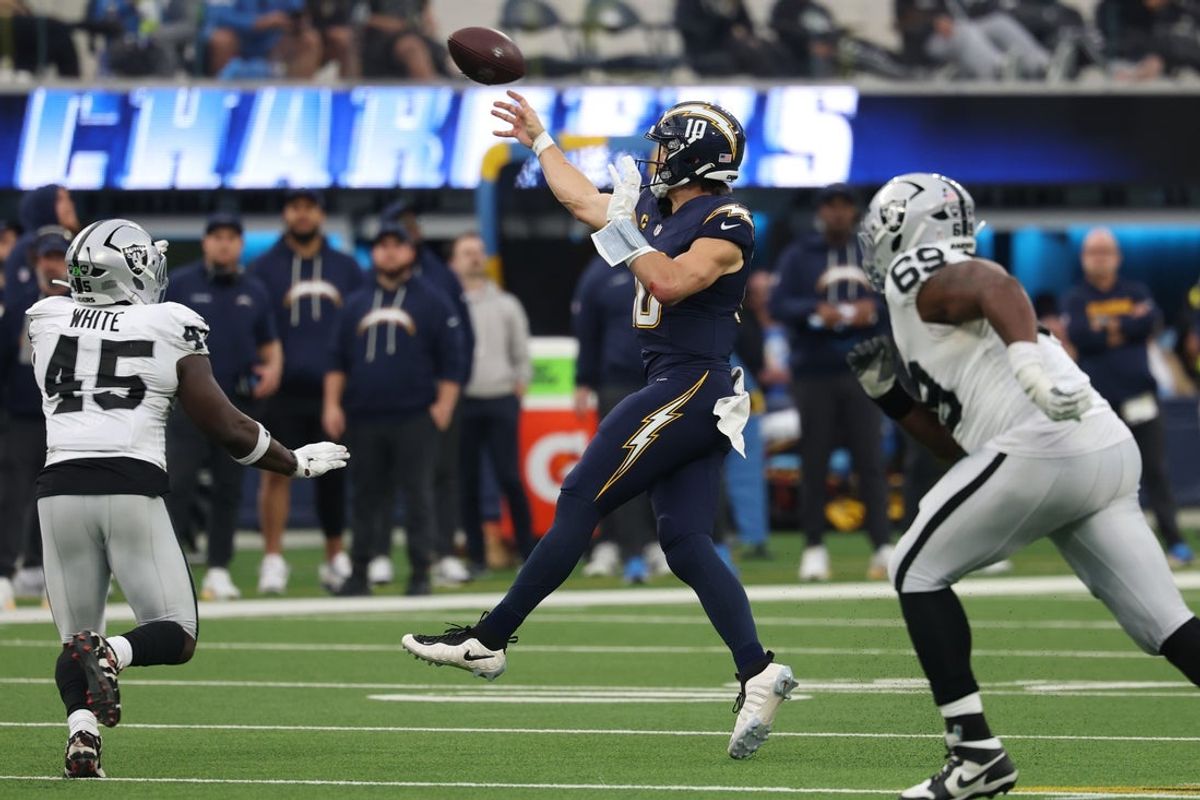 Nov 30, 2025; Inglewood, California, USA; Los Angeles Chargers quarterback Justin Herbert (10) throws a pass against the Las Vegas Raiders during the second half at SoFi Stadium. Mandatory Credit: Kiyoshi Mio-Imagn Images