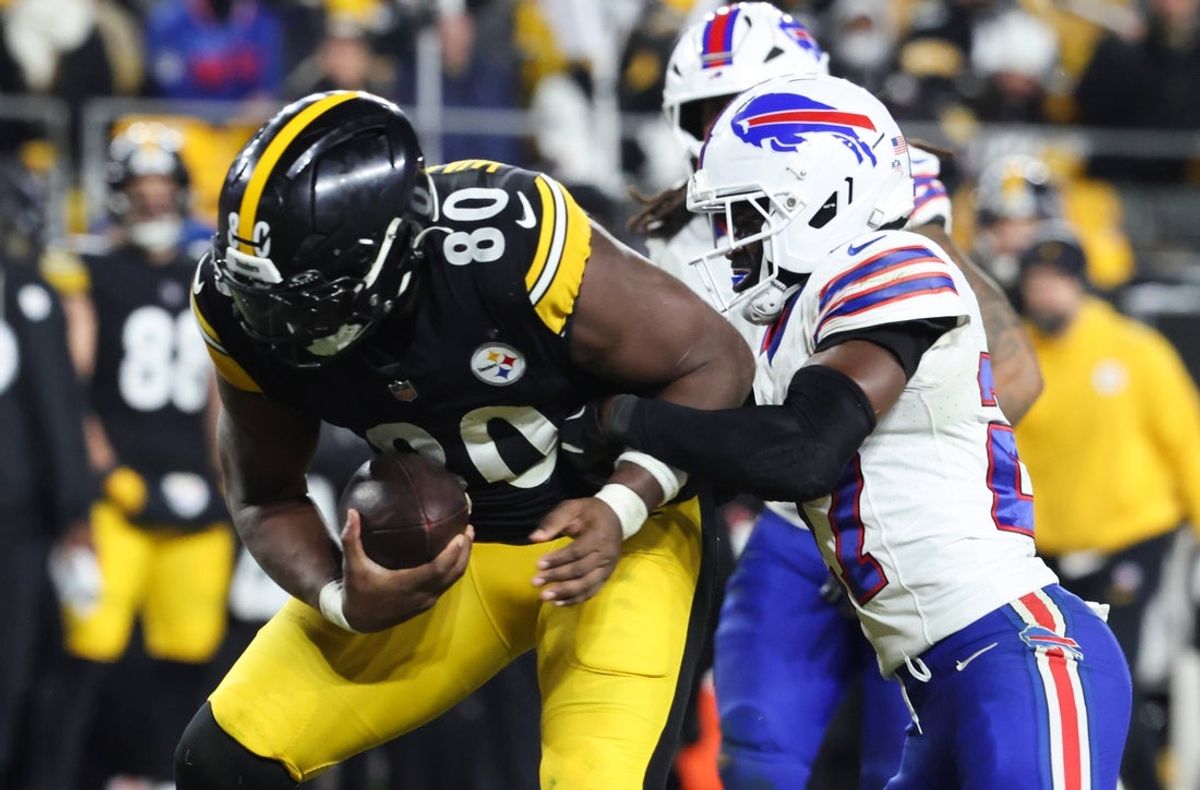 Nov 30, 2025; Pittsburgh, Pennsylvania, USA; Pittsburgh Steelers tight end Darnell Washington (80) rushes and is tackled by Buffalo Bills cornerback Tre'Davious White (27) during the fourth quarter at Acrisure Stadium. Mandatory Credit: Charles LeClaire-Imagn Images