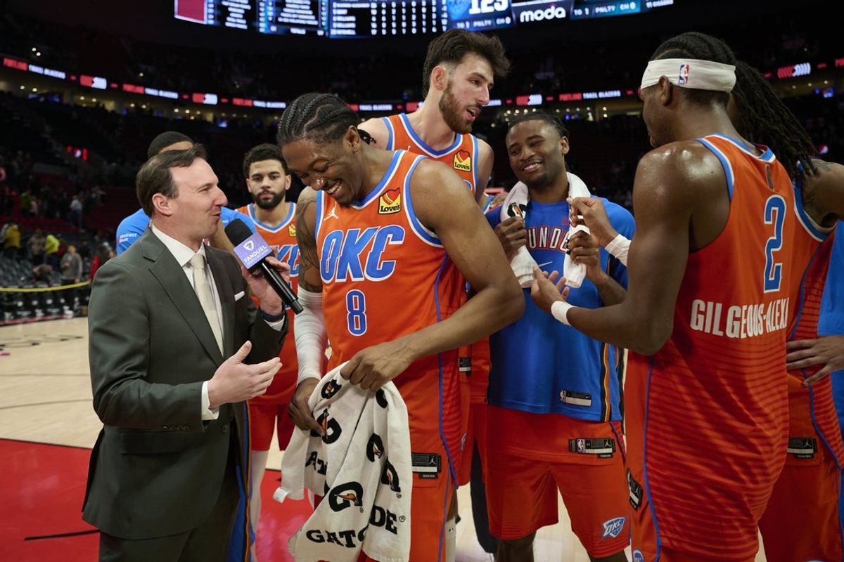 Nov 30, 2025; Portland, Oregon, USA; Oklahoma City Thunder guard Jalen Williams (8) laughs during a post-game interview with teammates after a game against the Portland Trail Blazers at Moda Center. Mandatory Credit: Troy Wayrynen-Imagn Images