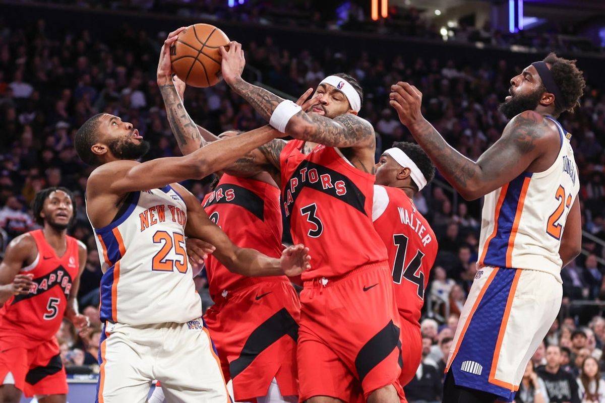 Nov 30, 2025; New York, New York, USA;  New York Knicks guard Mikal Bridges (25) and Toronto Raptors forward Brandon Ingram (3) fight for a loose ball in the fourth quarter at Madison Square Garden. Mandatory Credit: Wendell Cruz-Imagn Images