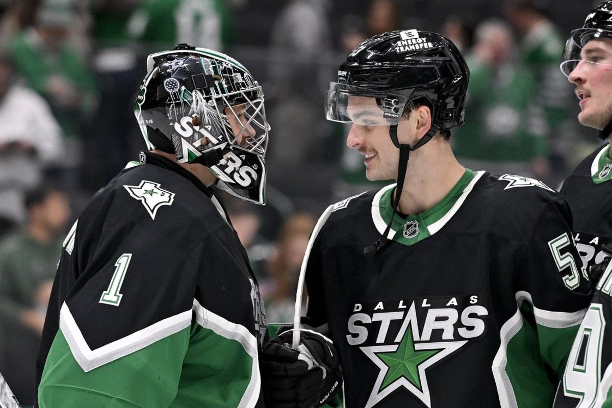 Nov 30, 2025; Dallas, Texas, USA; Dallas Stars goaltender Casey DeSmith (1) and center Wyatt Johnston (53) celebrate the Stars victory over the Ottawa Senators at the American Airlines Center. Mandatory Credit: Jerome Miron-Imagn Images