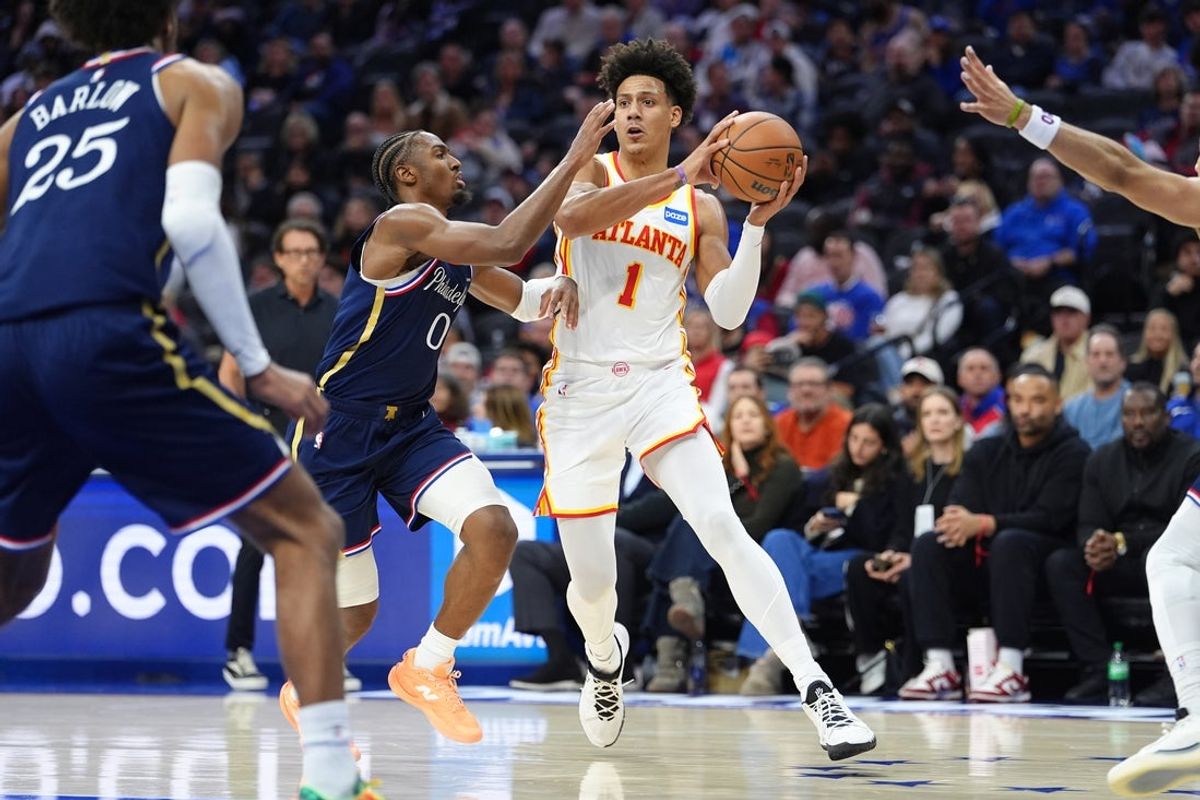 Nov 30, 2025; Philadelphia, Pennsylvania, USA; Atlanta Hawks forward Jalen Johnson (1) drives against Philadelphia 76ers guard Tyrese Maxey (0) in the second quarter at Xfinity Mobile Arena. Mandatory Credit: Kyle Ross-Imagn Images