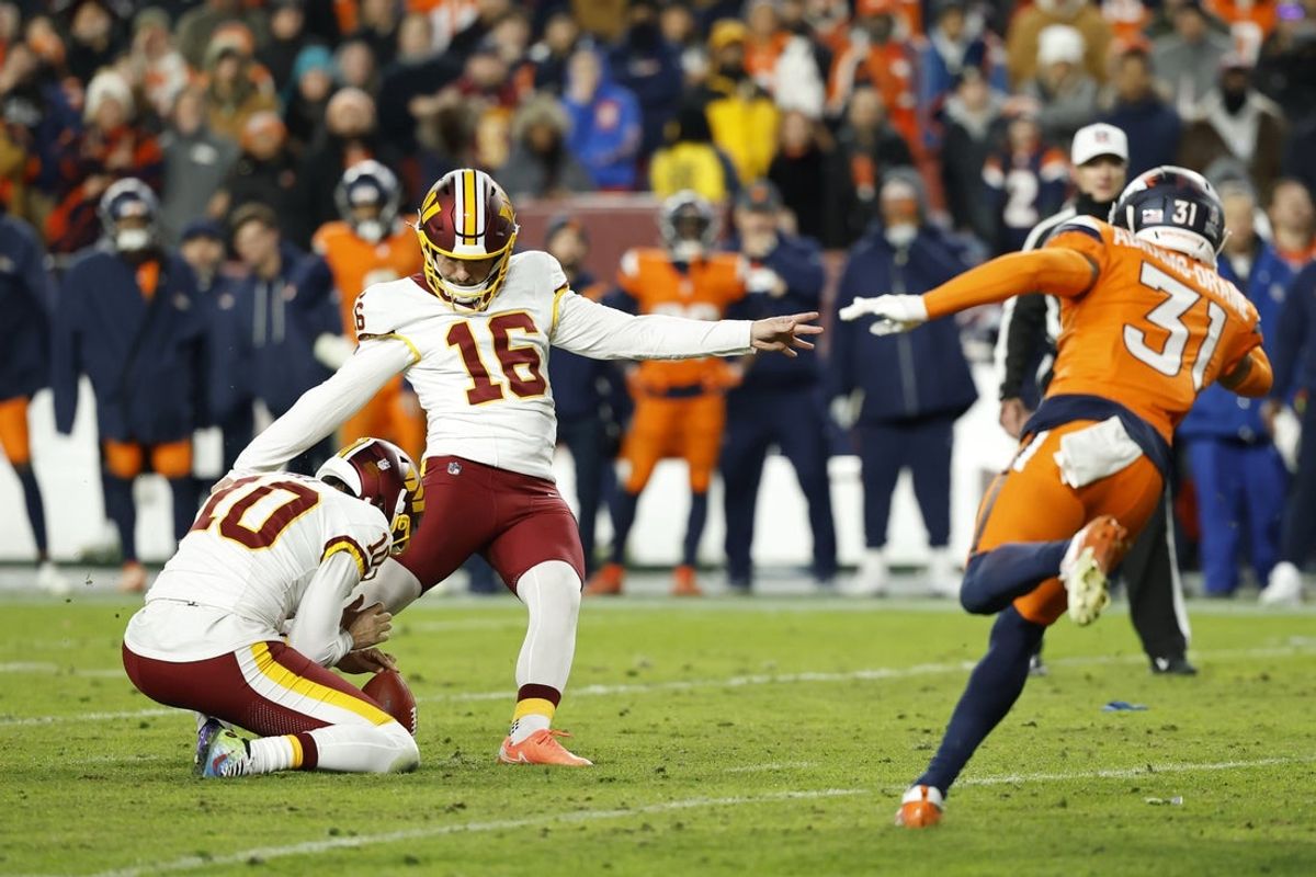 Nov 30, 2025; Landover, Maryland, USA; Washington Commanders kicker Jake Moody (16) kicks the game tying field goal in the final seconds in the fourth quarter at Northwest Stadium. Mandatory Credit: Geoff Burke-Imagn Images