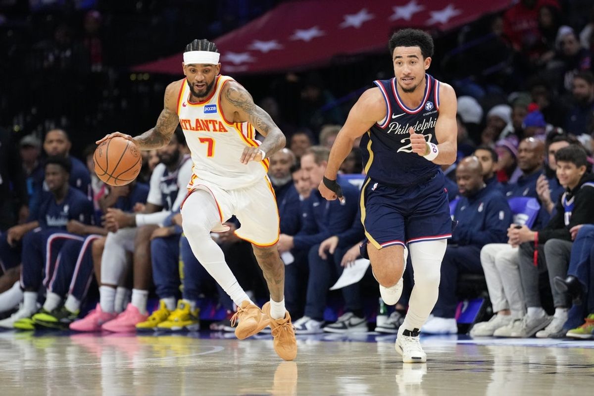 Nov 30, 2025; Philadelphia, Pennsylvania, USA; Atlanta Hawks guard Nickeil Alexander-Walker (7) drives against Philadelphia 76ers guard Jared McCain (20) in the second quarter at Xfinity Mobile Arena. Mandatory Credit: Kyle Ross-Imagn Images