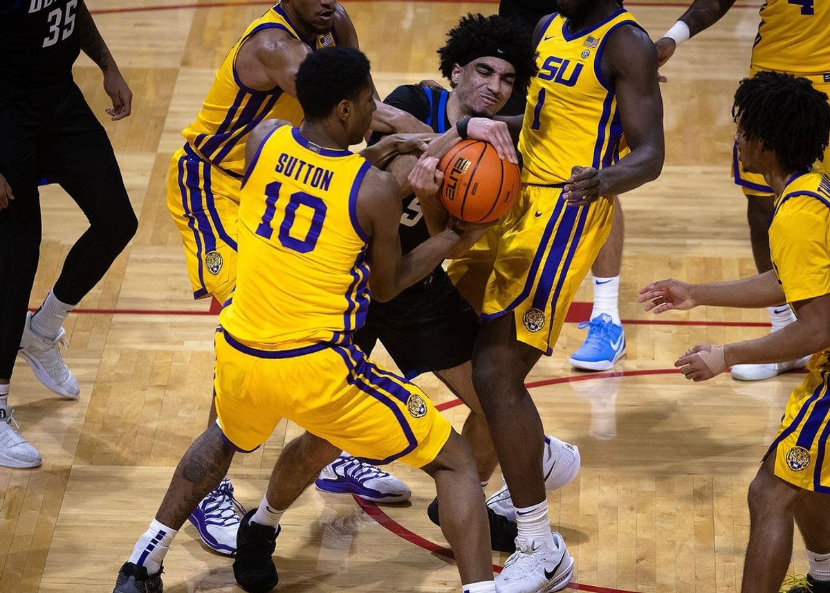 DePaul's RJ Smith (5) and LSU's Marquel Sutton (10) battle for a loose ball during the Emerald Coast Classic championship game at Raider Arena in Niceville, Fla., Nov. 29, 2025. The Tigers won the contest 96-63. (Tyler Orsburn/News Herald)