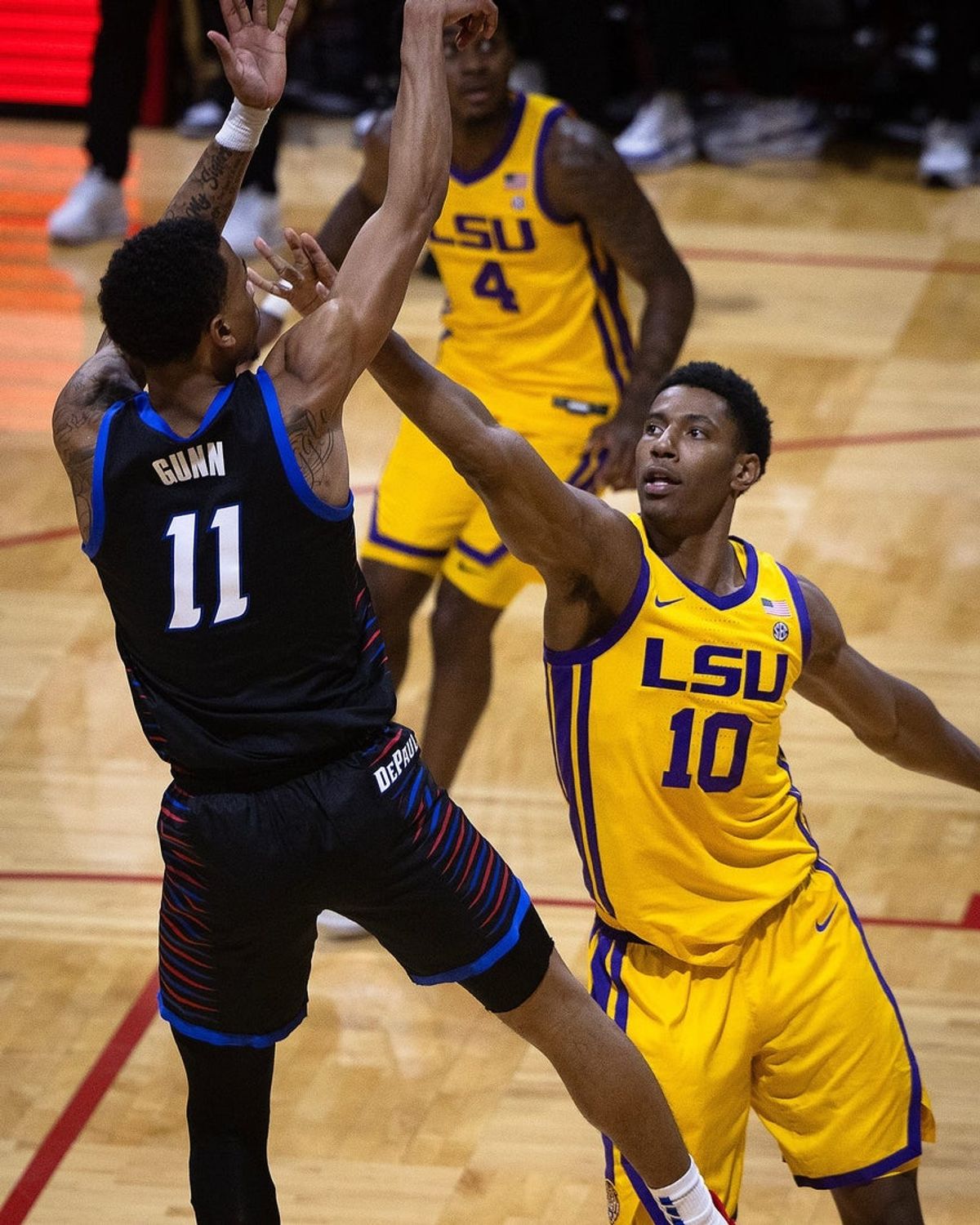 DePaul's CJ Gunn (11) shoots over LSU's Marquel Sutton (10) during the Emerald Coast Classic championship game at Raider Arena in Niceville, Fla., Nov. 29, 2025. The Tigers won the contest 96-63. (Tyler Orsburn/News Herald)