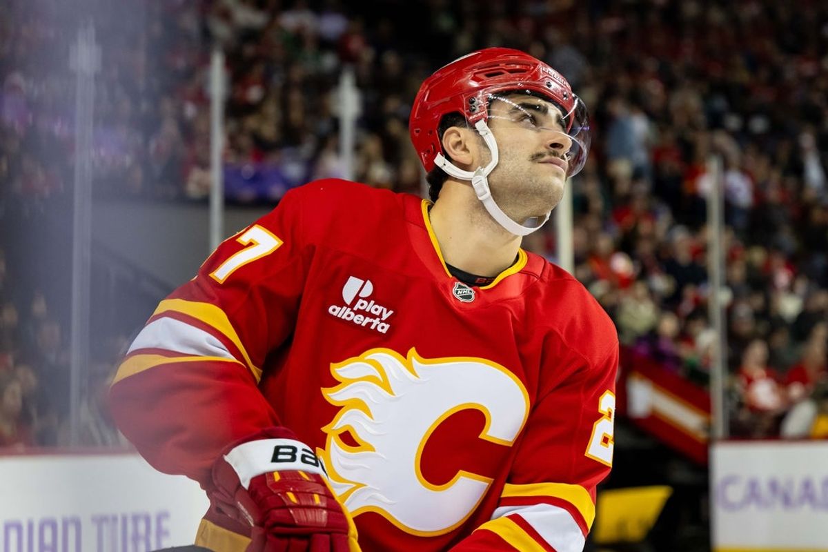 Nov 22, 2025; Calgary, Alberta, CAN; Calgary Flames right wing Matt Coronato (27) looks on against the Dallas Stars during the first period at Scotiabank Saddledome. Mandatory Credit: Brett Holmes-Imagn Images