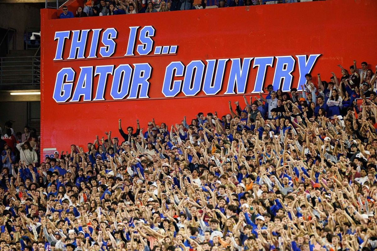 Nov 29, 2025; Gainesville, Florida, USA; A sign that reads This Is Gator Country is illuminated while fans cheer between the Florida Gators and Florida State Seminoles during the first half at Ben Hill Griffin Stadium. Mandatory Credit: Matt Pendleton-Imagn Images