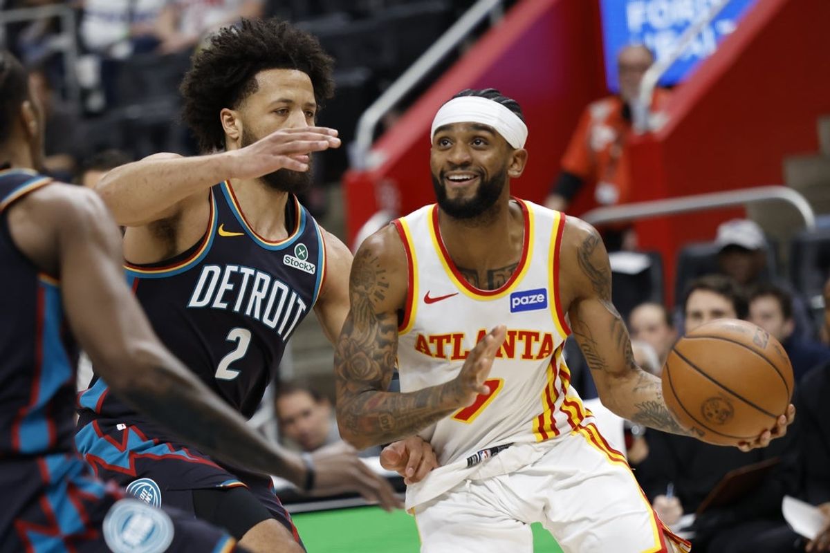Dec 1, 2025; Detroit, Michigan, USA;  Atlanta Hawks guard Nickeil Alexander-Walker (7) dribbles defended by Detroit Pistons guard Cade Cunningham (2) in the first half at Little Caesars Arena. Mandatory Credit: Rick Osentoski-Imagn Images