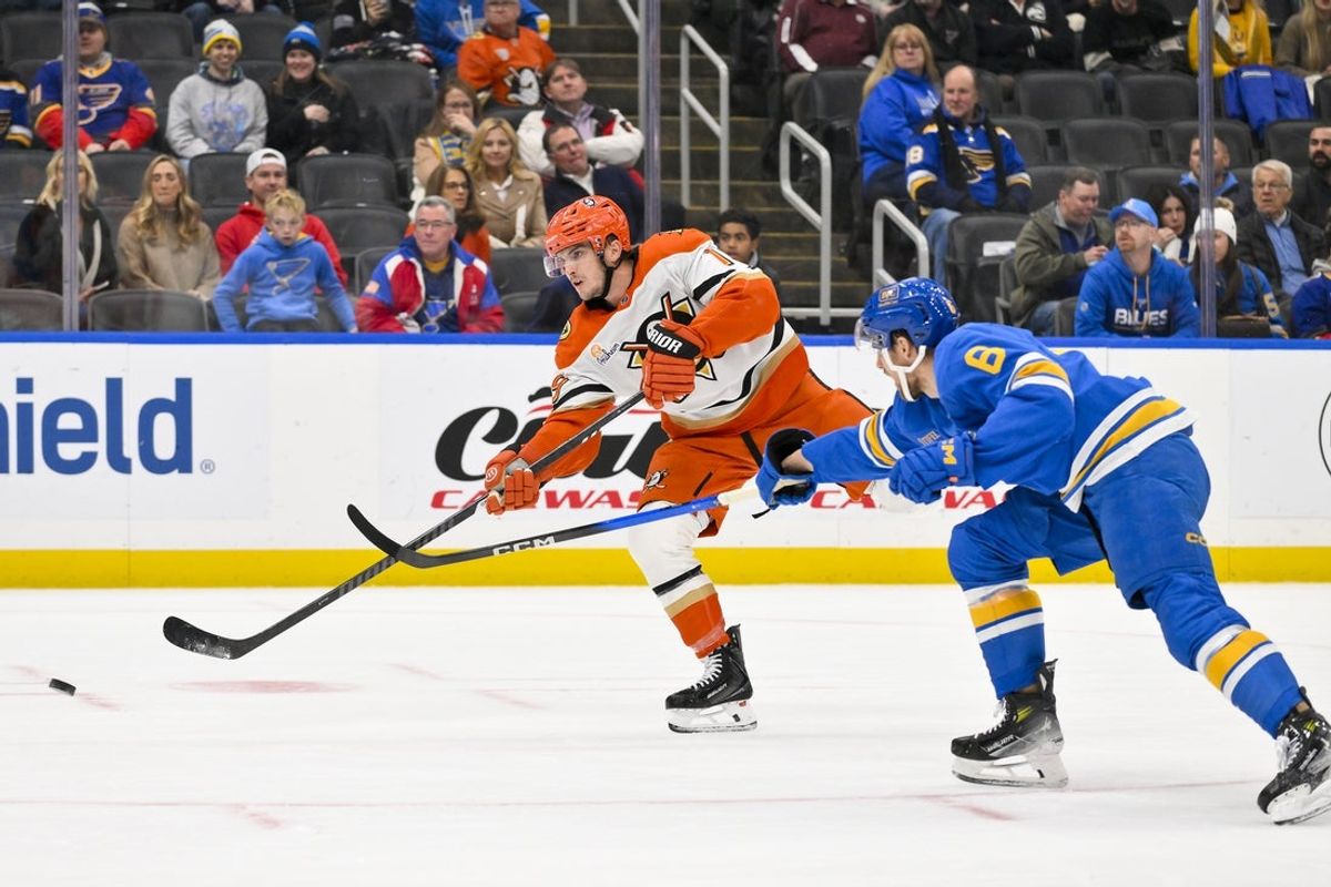 Dec 1, 2025; St. Louis, Missouri, USA; Anaheim Ducks right wing Troy Terry (19) shoots as St. Louis Blues defenseman Philip Broberg (6) defends during the first period at Enterprise Center. Mandatory Credit: Jeff Curry-Imagn Images