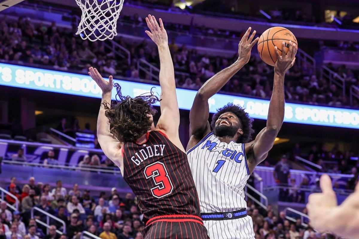 Dec 1, 2025; Orlando, Florida, USA; Orlando Magic forward Jonathan Isaac (1) goes to the basket against Chicago Bulls guard Josh Giddey (3) during the second quarter at Kia Center. Mandatory Credit: Mike Watters-Imagn Images