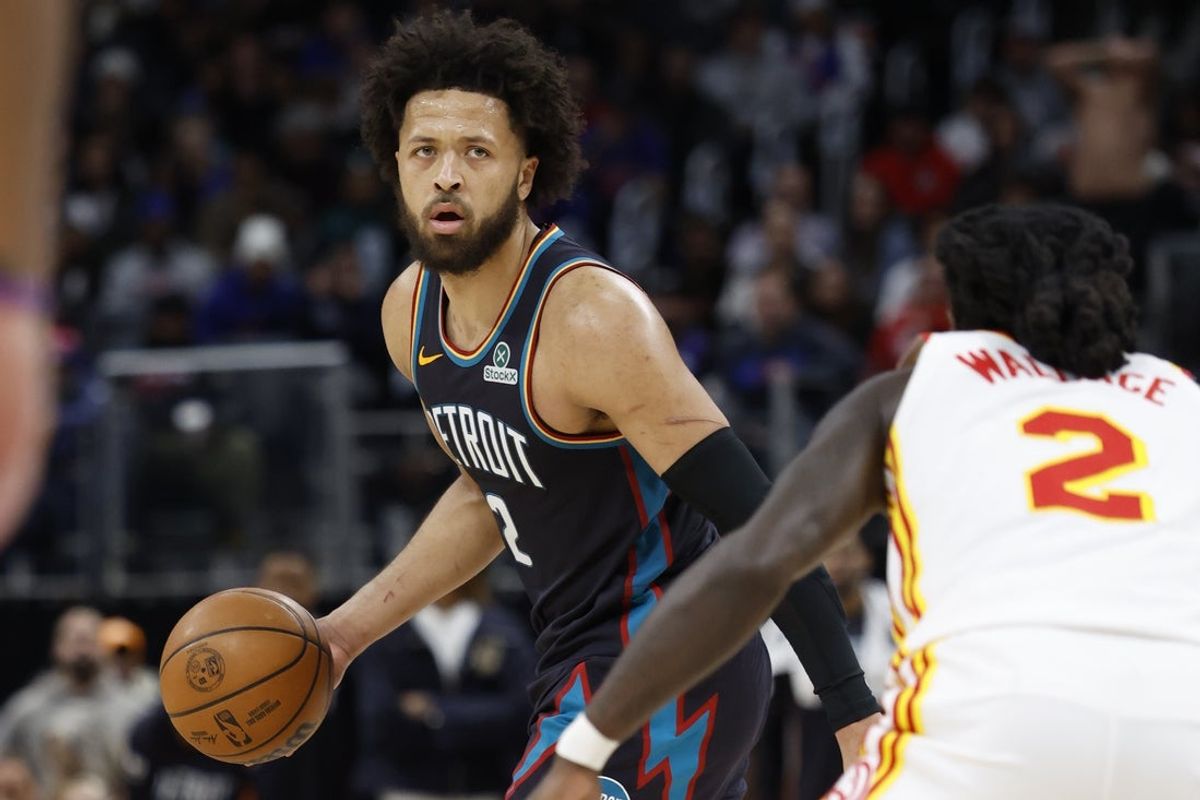 Dec 1, 2025; Detroit, Michigan, USA;  Detroit Pistons guard Cade Cunningham (2) dribbles defended by Atlanta Hawks guard Keaton Wallace (2) in the second half at Little Caesars Arena. Mandatory Credit: Rick Osentoski-Imagn Images