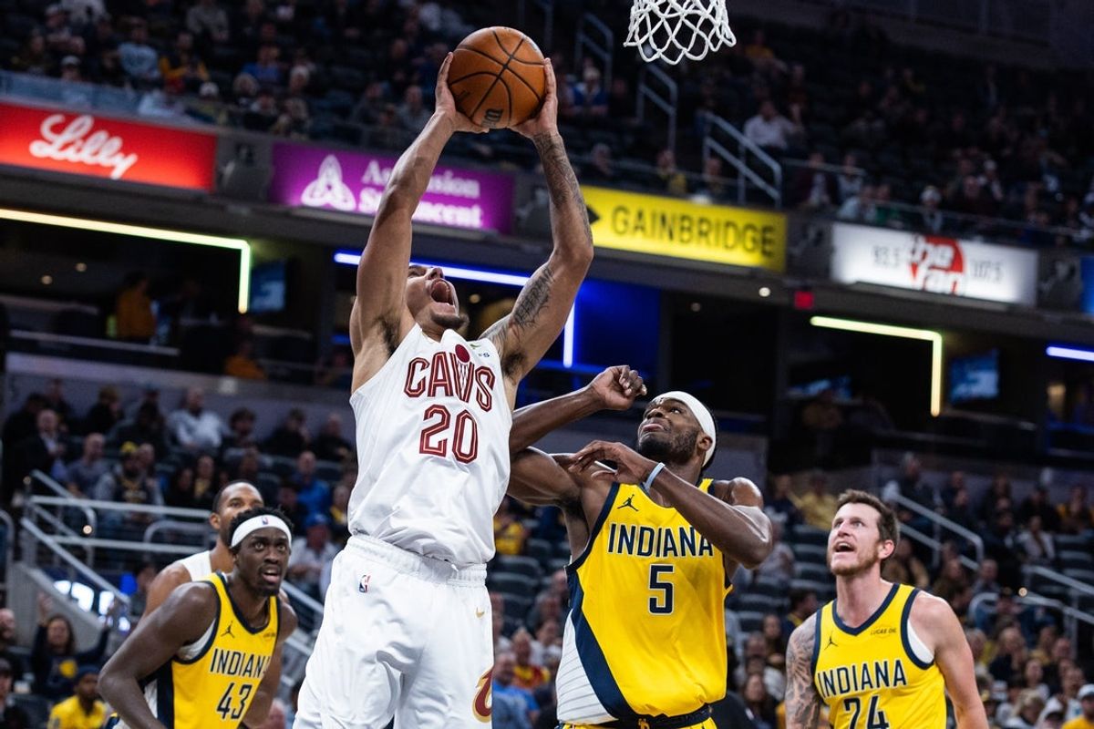 Dec 1, 2025; Indianapolis, Indiana, USA;  Cleveland Cavaliers guard Jaylon Tyson (20) shoots the ball while  Indiana Pacers forward Jarace Walker (5) defends in the first half at Gainbridge Fieldhouse. Mandatory Credit: Trevor Ruszkowski-Imagn Images