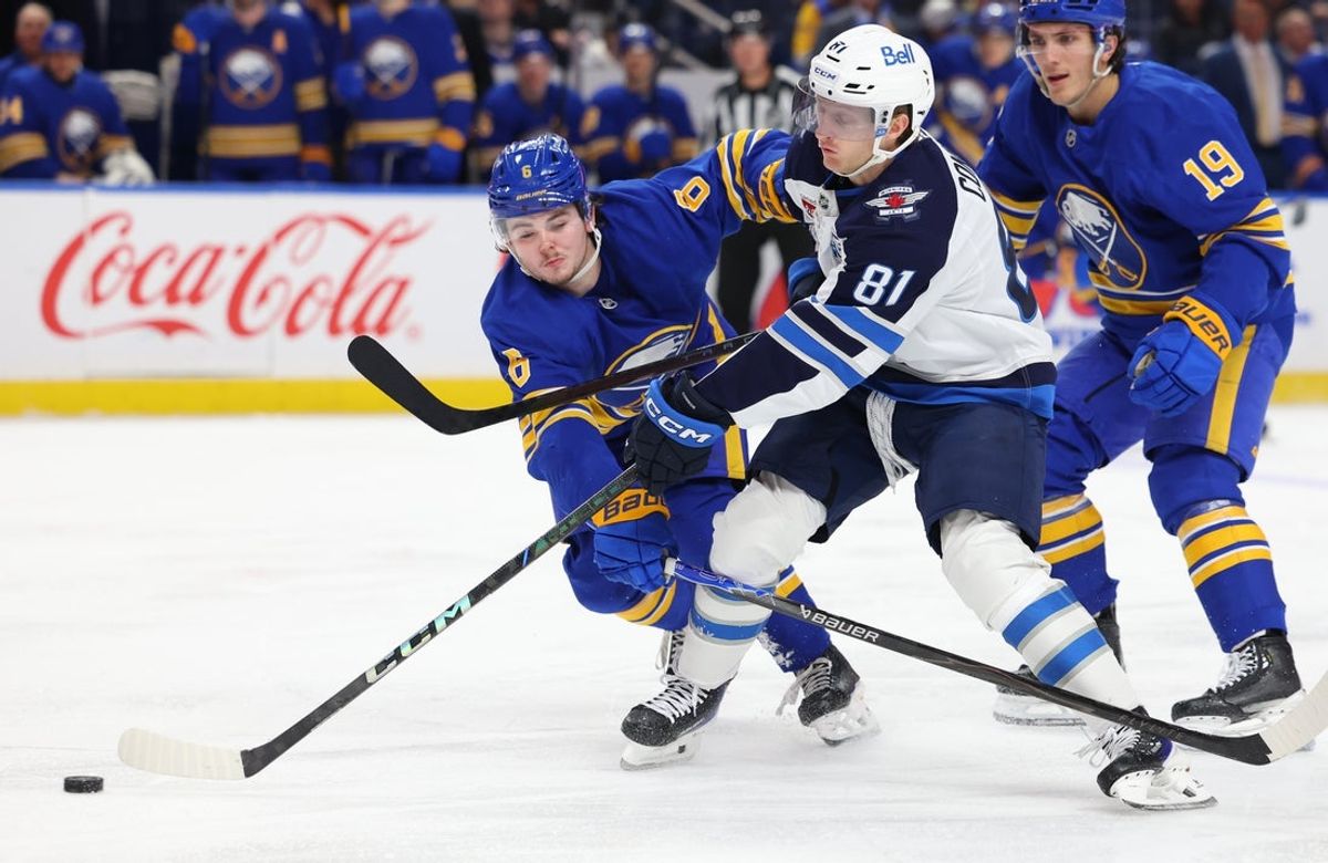 Dec 1, 2025; Buffalo, New York, USA;  Winnipeg Jets left wing Kyle Connor (81) takes a shot on goal as Buffalo Sabres left wing Zach Benson (6) tries to defend during the third period at KeyBank Center. Mandatory Credit: Timothy T. Ludwig-Imagn Images