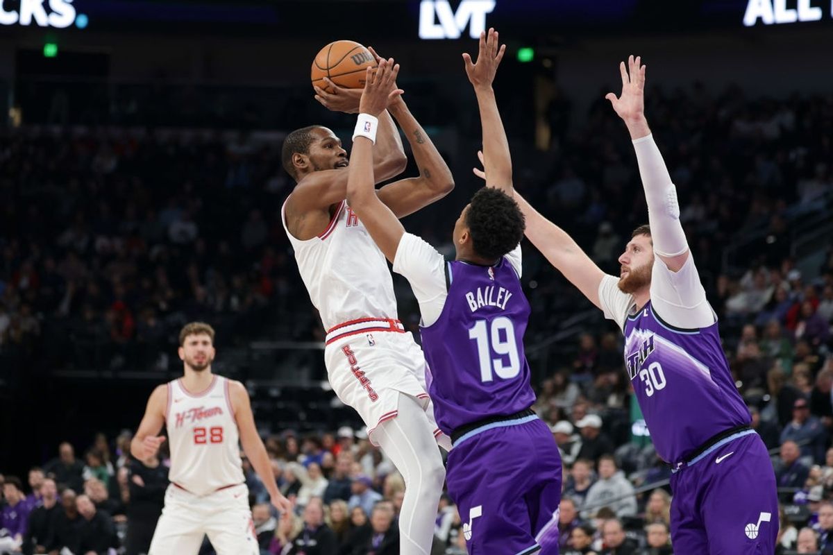 Dec 1, 2025; Salt Lake City, Utah, USA;  Houston Rockets forward Kevin Durant (7) shoots the ball past Utah Jazz guard Ace Bailey (19) during the second half at Delta Center. Mandatory Credit: Chris Nicoll-Imagn Images
