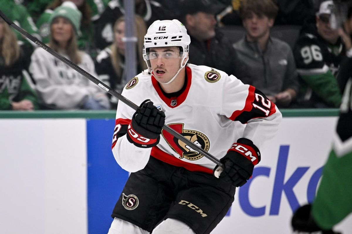 Nov 30, 2025; Dallas, Texas, USA; Ottawa Senators center Shane Pinto (12) skates in the Dallas zone during the game between the Stars and the Senators at the American Airlines Center. Mandatory Credit: Jerome Miron-Imagn Images