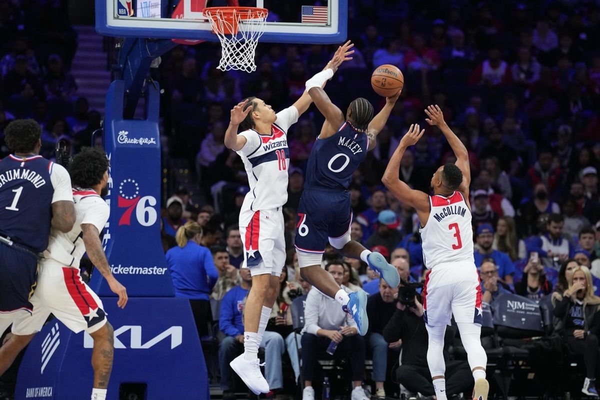 Dec 2, 2025; Philadelphia, Pennsylvania, USA; Philadelphia 76ers guard Tyrese Maxey (0) drives to shoot against Washington Wizards forward Kyshawn George (18) in the first quarter at Xfinity Mobile Arena. Mandatory Credit: Kyle Ross-Imagn Images