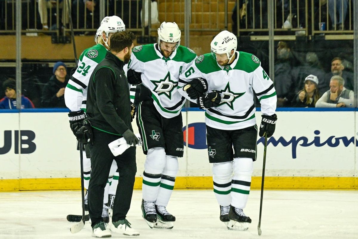 Dec 2, 2025; New York, New York, USA;  Dallas Stars center Tyler Seguin (91) helped off the ice by Dallas Stars center Roope Hintz (24) and Dallas Stars defenseman Ilya Lyubushkin (46) in the game against the New York Rangers during the first period at Madison Square Garden. Mandatory Credit: Dennis Schneidler-Imagn Images