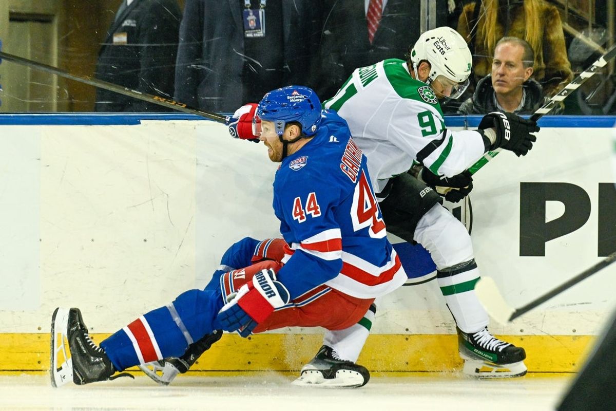 Dec 2, 2025; New York, New York, USA;  New York Rangers defenseman Vladislav Gavrikov (44) falls on the knee of Dallas Stars center Tyler Seguin (91) during the first period at Madison Square Garden. Mandatory Credit: Dennis Schneidler-Imagn Images