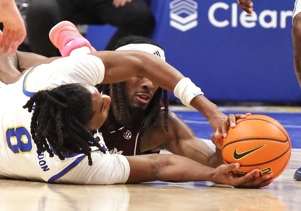 Dec 2, 2025; Pittsburgh, Pennsylvania, USA;  Pittsburgh Panthers guard Omari Witherspoon (8) and Texas A&M Aggies forward Mackenzie Mgbako (rear) fight for a loose ball during the first half at the Petersen Events Center. Mandatory Credit: Charles LeClaire-Imagn Images