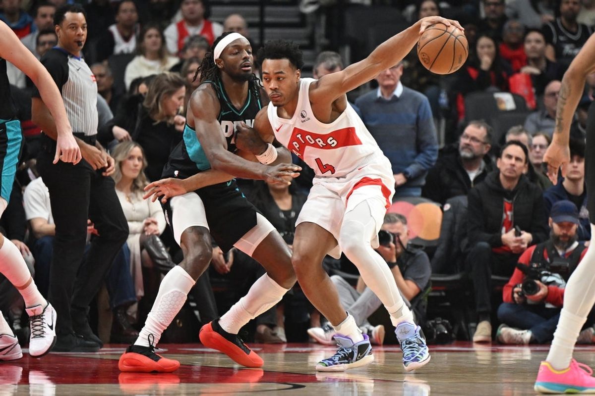 Dec 2, 2025; Toronto, Ontario, CAN; Toronto Raptors forward Scottie Barnes (4) tries to move the ball past Portland Trail Blazers forward Jerami Grant (9) in the first   half at Scotiabank Arena. Mandatory Credit: Dan Hamilton-Imagn Images