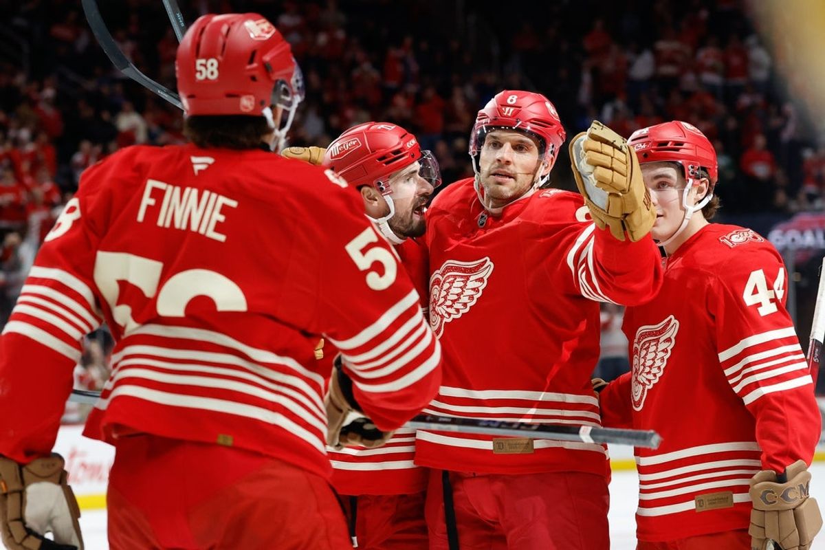 Dec 2, 2025; Detroit, Michigan, USA;  Detroit Red Wings defenseman Ben Chiarot (8) receives congratulations from teammates after scoring in the second period against the Boston Bruins at Little Caesars Arena. Mandatory Credit: Rick Osentoski-Imagn Images