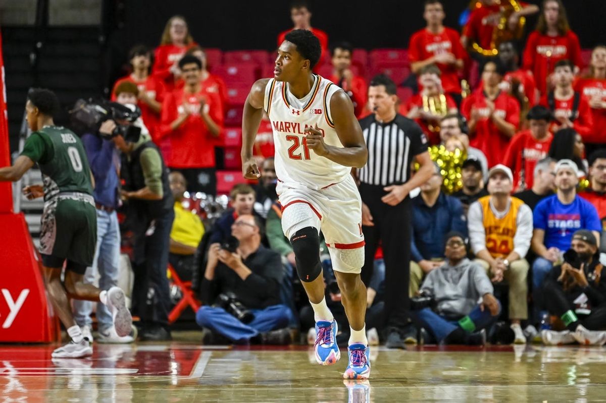 Dec 2, 2025; College Park, Maryland, USA;  Maryland Terrapins forward Pharrel Payne (21) runs down the court after making  a first half basket against the Wagner Seahawks at Xfinity Center. Mandatory Credit: Tommy Gilligan-Imagn Images