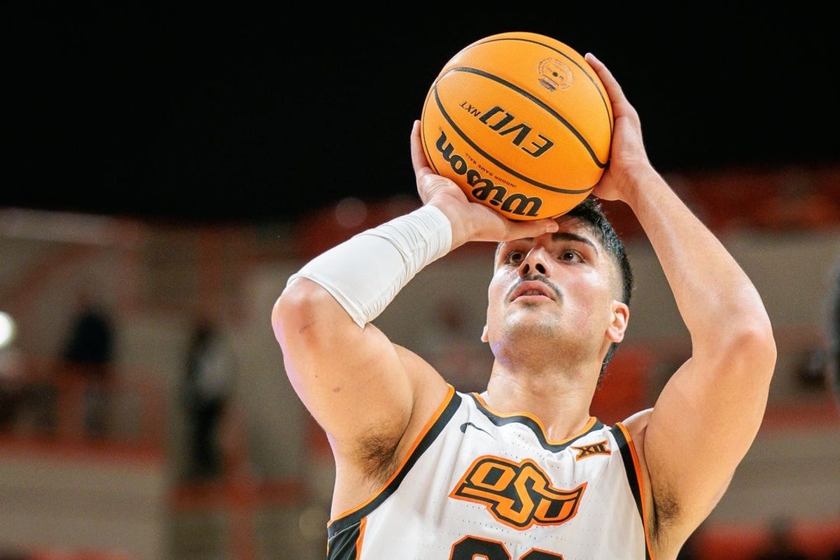 Dec 2, 2025; Stillwater, Oklahoma, USA; Oklahoma State Cowboys center Parsa Fallah (22) shoots the ball during the first half against the Sam Houston Bearkats at Gallagher-Iba Arena. Mandatory Credit: William Purnell-Imagn Images