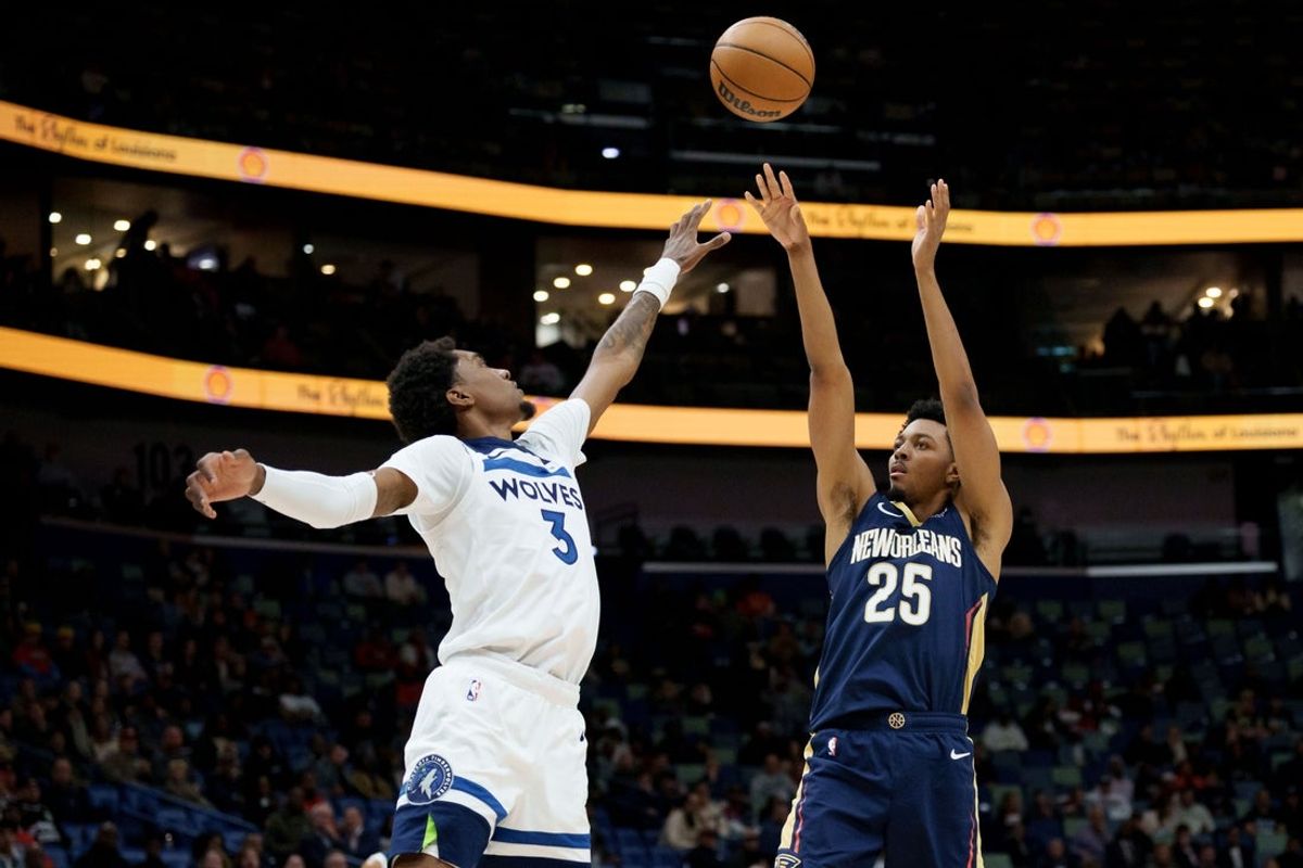 Dec 2, 2025; New Orleans, Louisiana, USA; New Orleans Pelicans forward Trey Murphy III (25) shoots against Minnesota Timberwolves forward Jaden McDaniels (3) during the first half at Smoothie King Center. Mandatory Credit: Matthew Hinton-Imagn Images