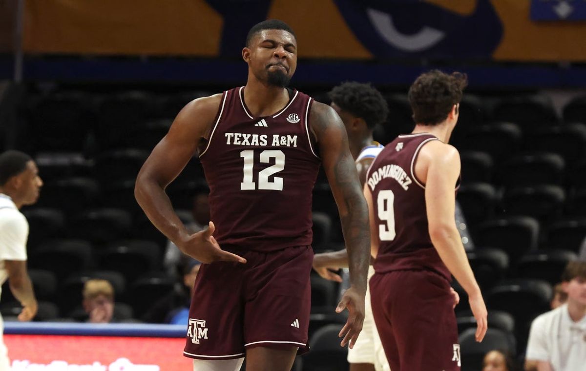 Dec 2, 2025; Pittsburgh, Pennsylvania, USA;  Texas A&M Aggies forward Rashaun Agee (12) reacts after making a three point basket against the Pittsburgh Panthers during the second half at the Petersen Events Center. Mandatory Credit: Charles LeClaire-Imagn Images