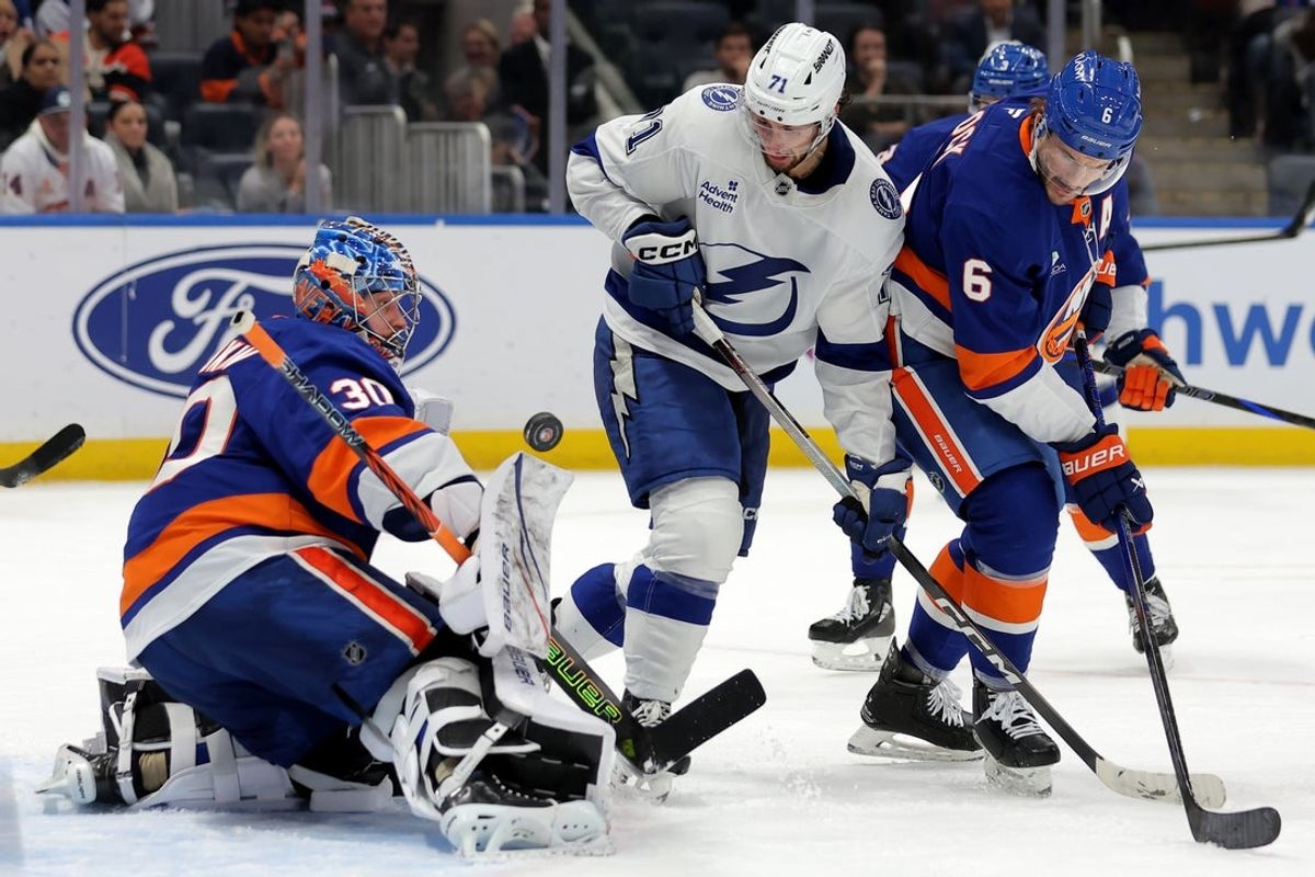 Dec 2, 2025; Elmont, New York, USA; New York Islanders goaltender Ilya Sorokin (30) makes a save in front of Tampa Bay Lightning center Anthony Cirelli (71) and Islanders defenseman Ryan Pulock (6) during the third period at UBS Arena. Mandatory Credit: Brad Penner-Imagn Images