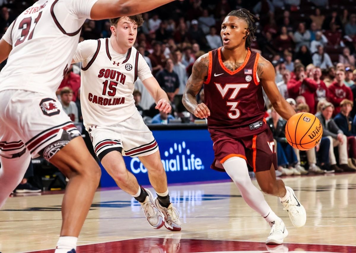 Dec 2, 2025; Columbia, South Carolina, USA; Virginia Tech Hokies guard Ben Hammond (3) drives around South Carolina Gamecocks guard Eli Ellis (15) in the second half at Colonial Life Arena. Mandatory Credit: Jeff Blake-Imagn Images