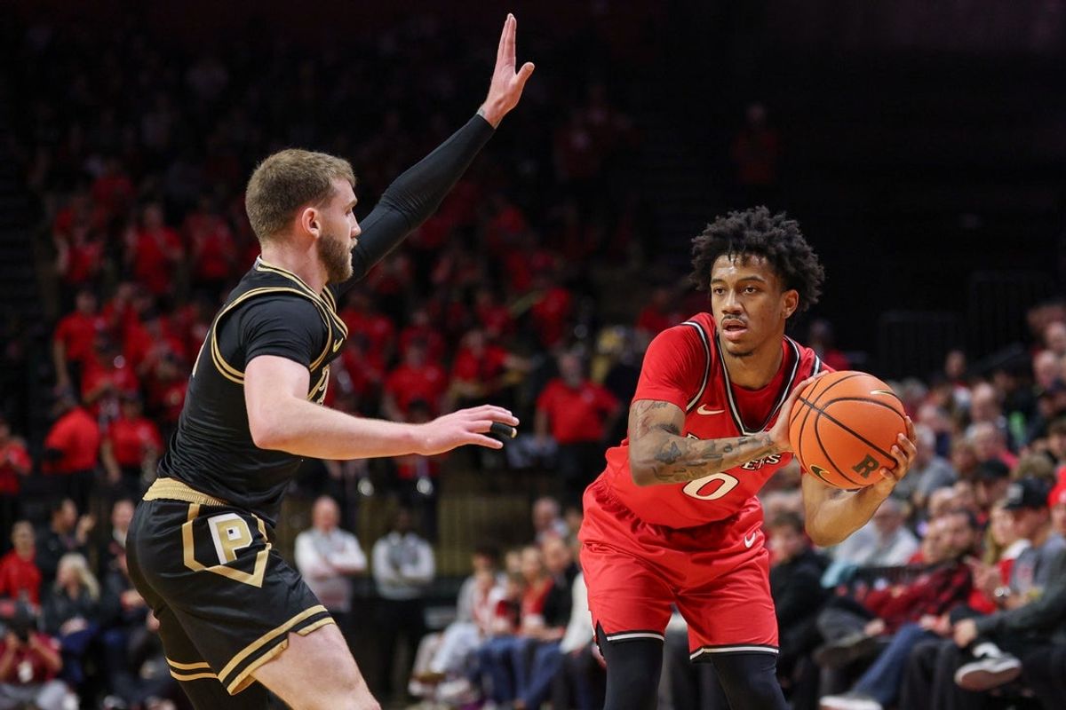 Dec 2, 2025; Piscataway, New Jersey, USA; Rutgers Scarlet Knights guard Tariq Francis (0) looks to pass as Purdue Boilermakers guard Braden Smith (3) defends during the second half at Jersey Mike's Arena. Mandatory Credit: Vincent Carchietta-Imagn Images